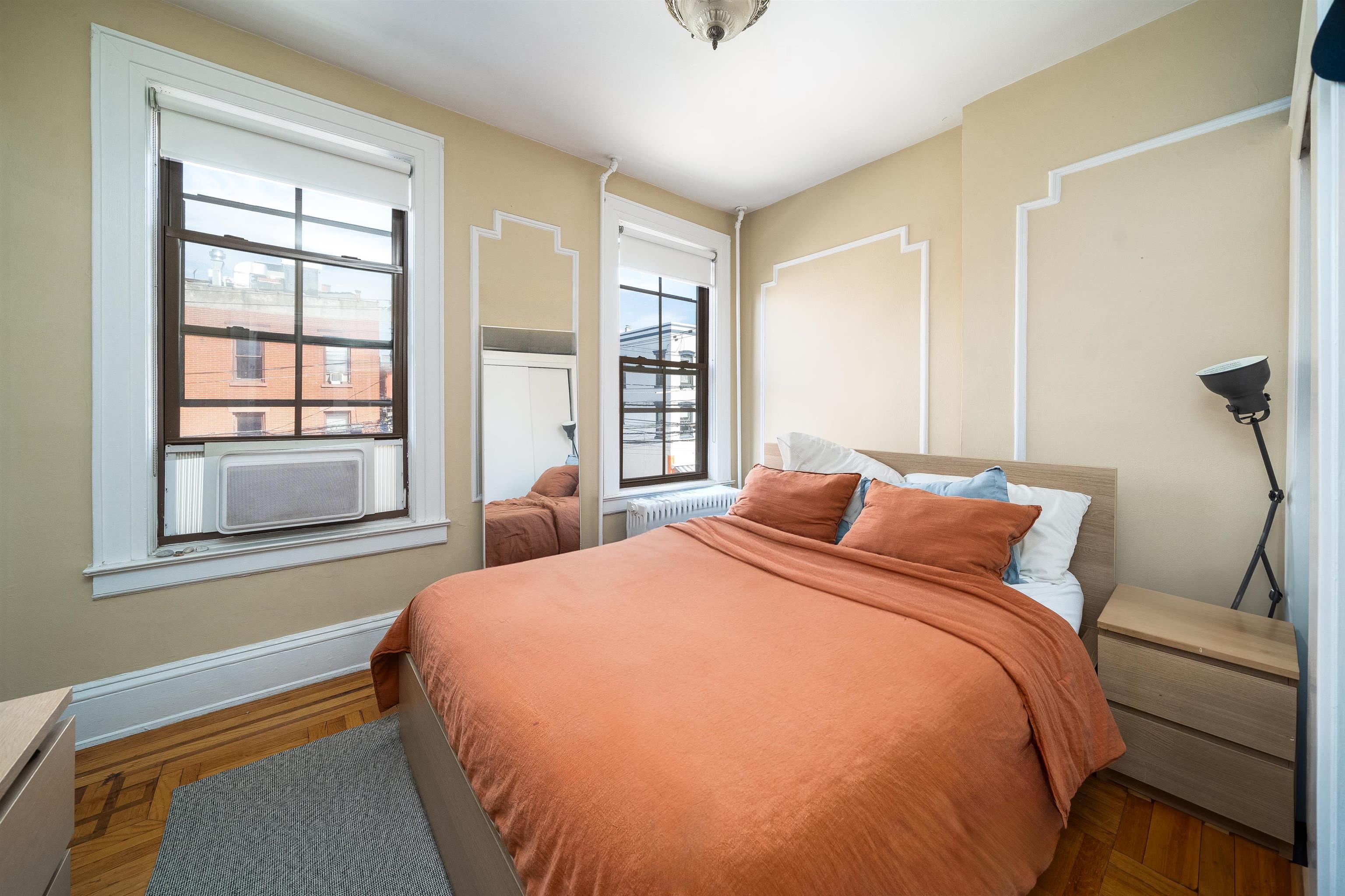 800 Bloomfield Street Hoboken, NJ 07030 - Photo 8 of 38 a bedroom with a bed and a window