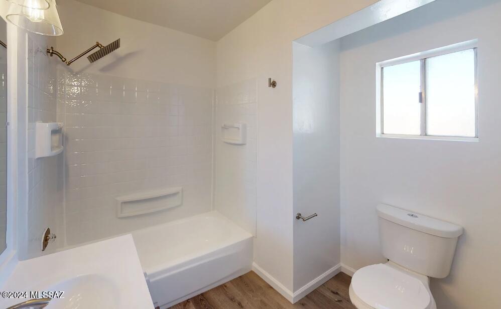 2118 North Rita Avenue Tucson, AZ 85716 - Photo 10 of 17 a bathroom with a toilet and a bathtub