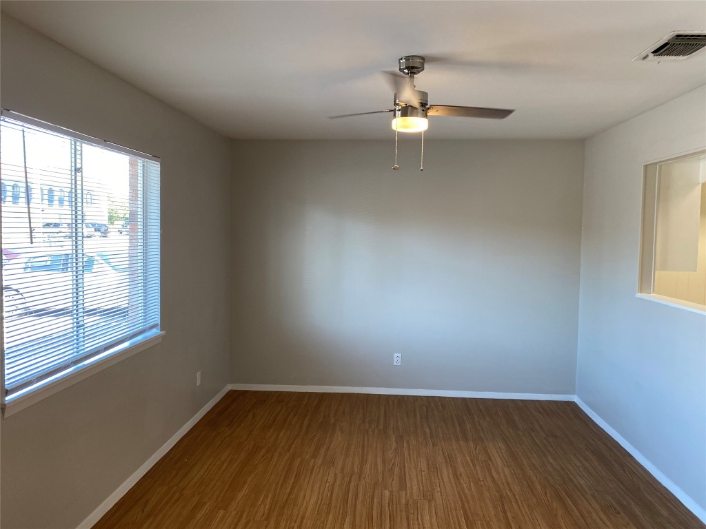 1053 Linde Avenue, Unit 1061 New Braunfels, TX 78130 - Photo 1 of 7 wooden floor in an empty room with a window