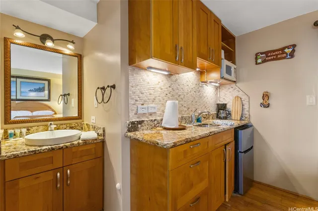 a picture of a bathroom with a shower and a sink