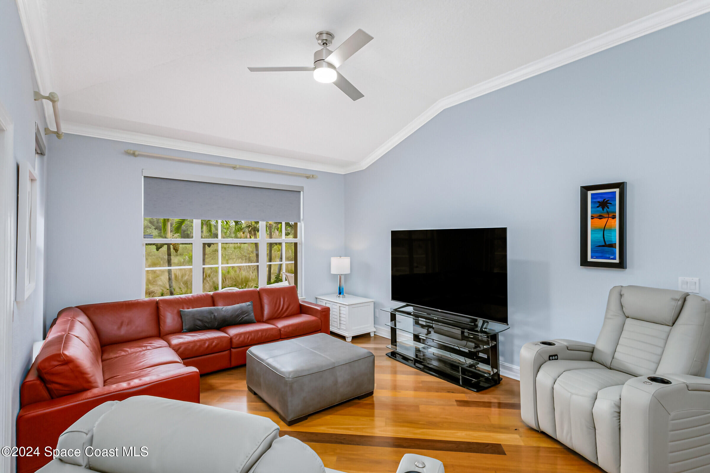 4481 Aberdeen Circle Rockledge, FL 32955 - Photo 13 of 50 a living room with furniture and a flat screen tv