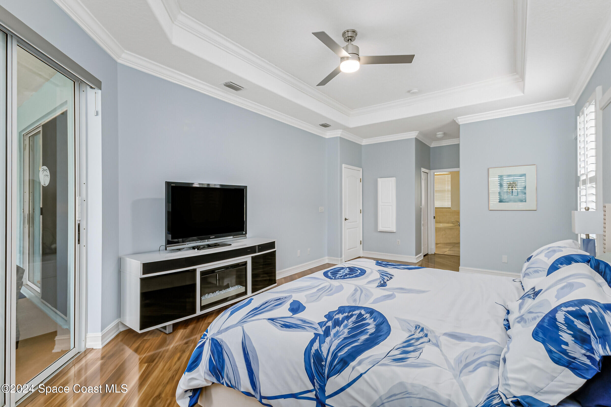 4481 Aberdeen Circle Rockledge, FL 32955 - Photo 16 of 50 a bedroom with a bed and a flat screen tv