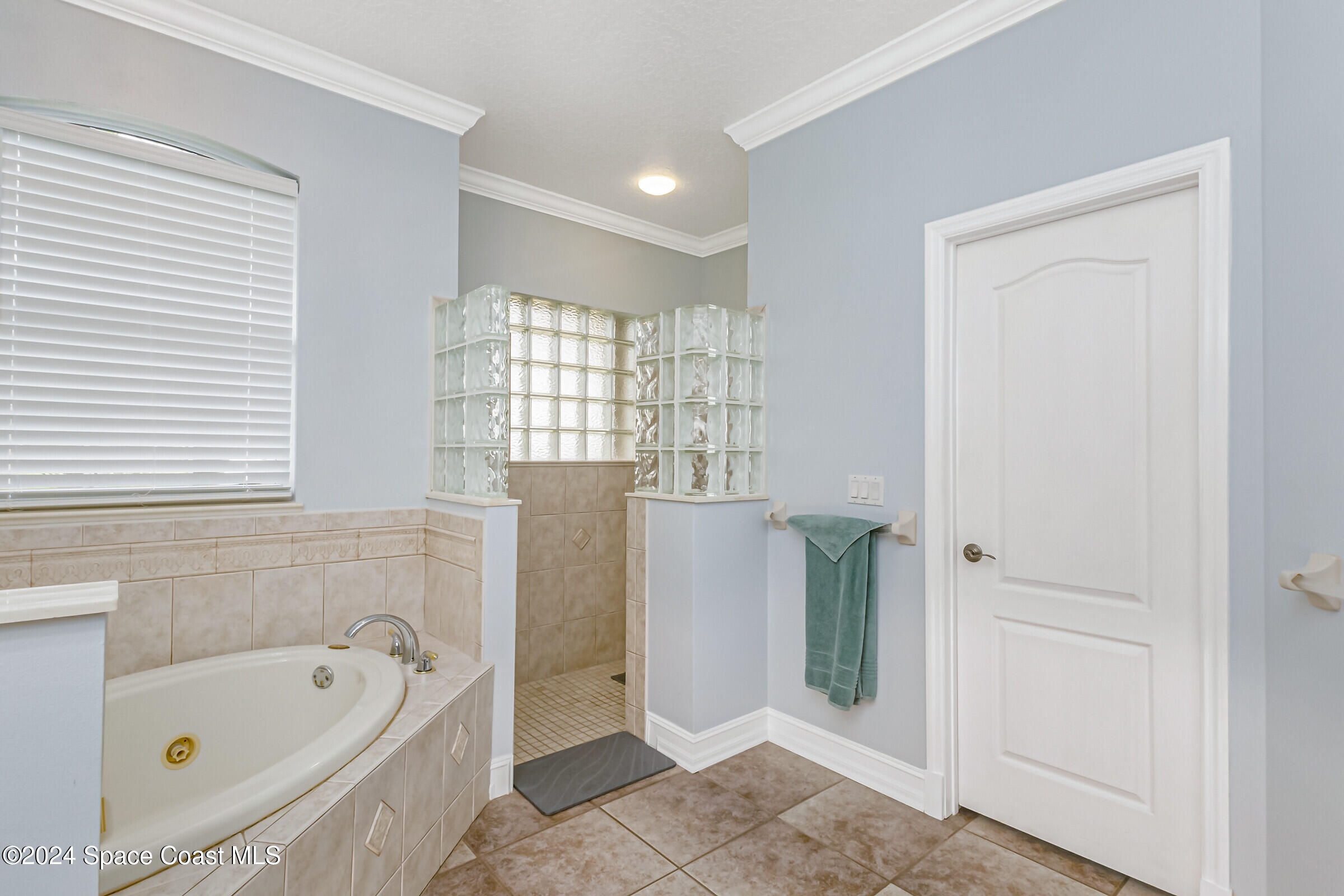 4481 Aberdeen Circle Rockledge, FL 32955 - Photo 20 of 50 a bathroom with a tub a sink and a shower