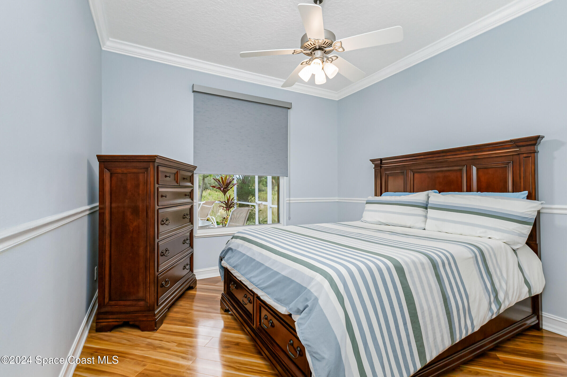 4481 Aberdeen Circle Rockledge, FL 32955 - Photo 22 of 50 a bedroom with a bed and wooden floor