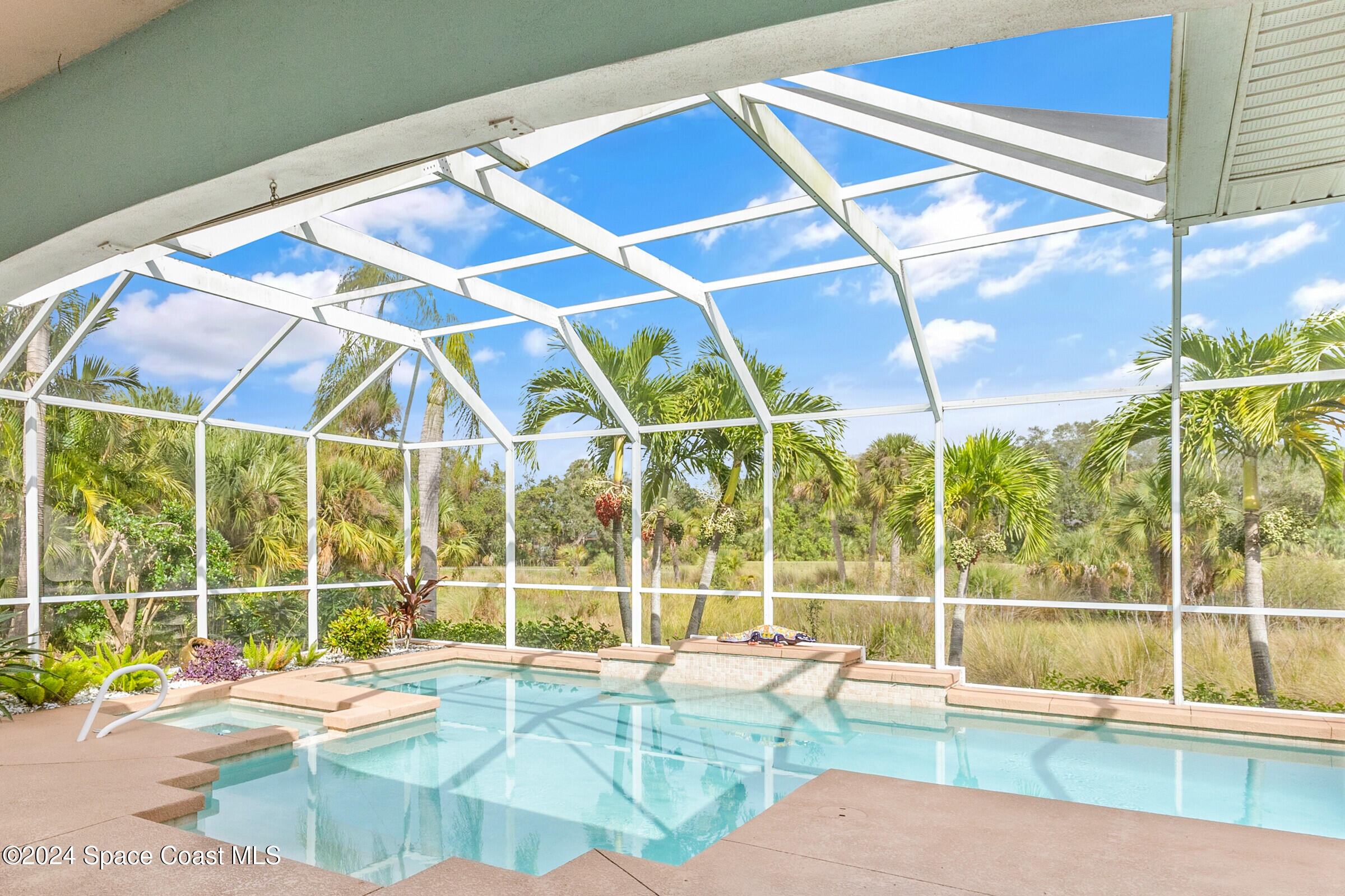 4481 Aberdeen Circle Rockledge, FL 32955 - Photo 30 of 50 a view of a swimming pool with a patio