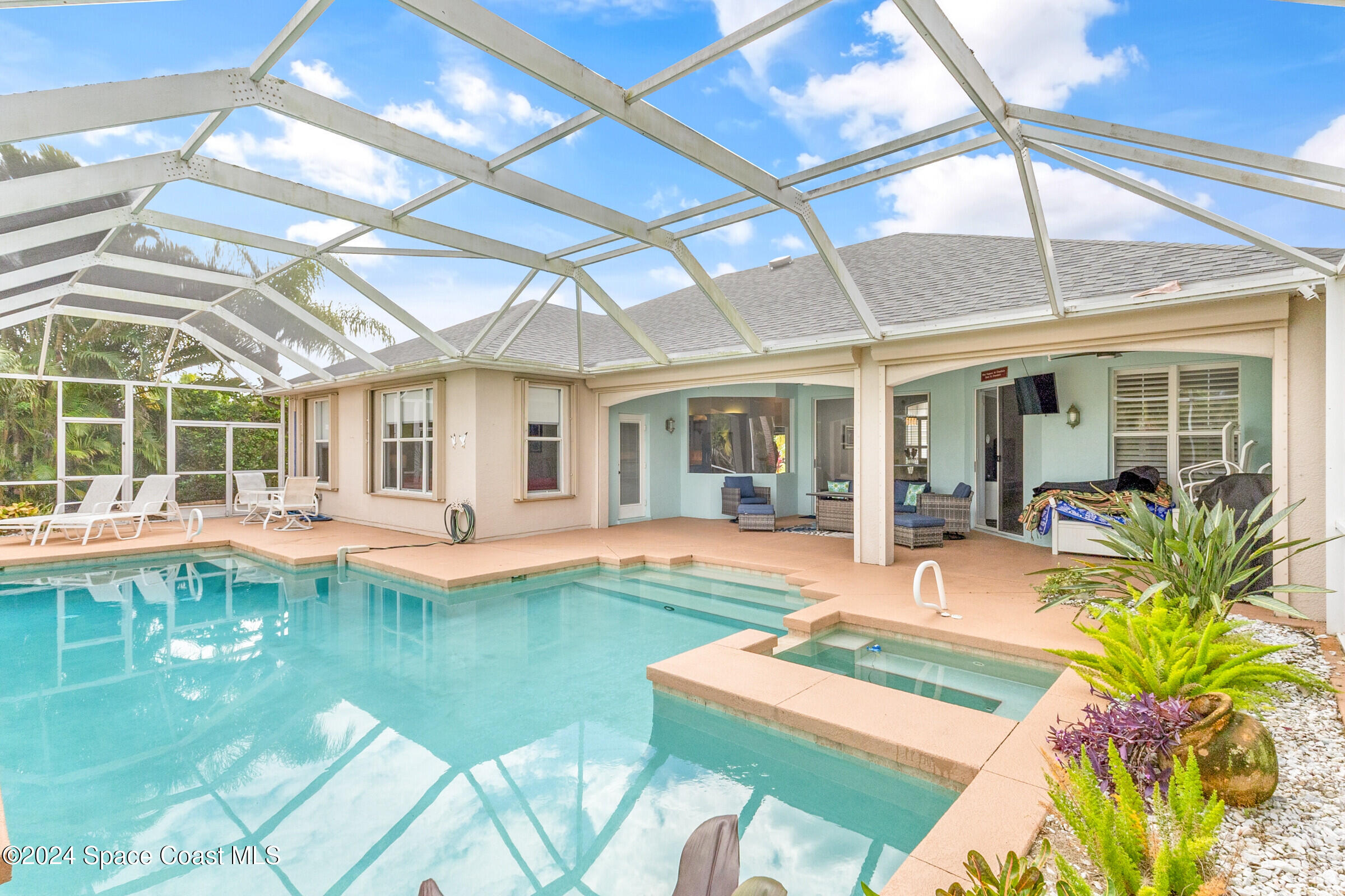 4481 Aberdeen Circle Rockledge, FL 32955 - Photo 33 of 50 a front view of a house with swimming pool having outdoor seating