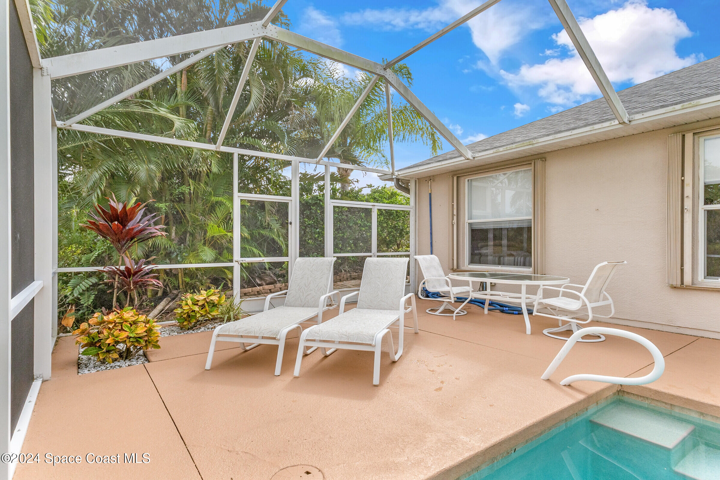 4481 Aberdeen Circle Rockledge, FL 32955 - Photo 34 of 50 a living room with patio furniture and a window