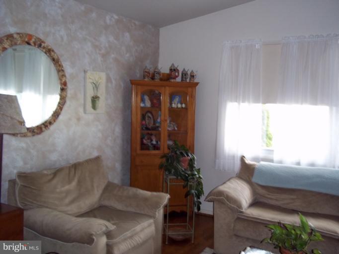 6919 Digby Road Gwynn Oak, MD 21207 - Photo 18 of 24 a living room with furniture and a mirror