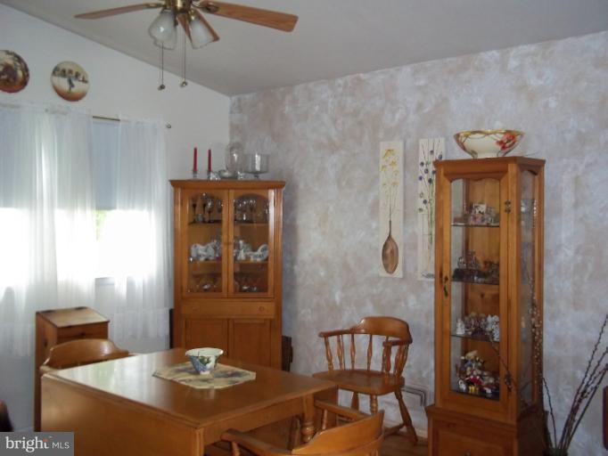 6919 Digby Road Gwynn Oak, MD 21207 - Photo 19 of 24 a dining room with furniture and window