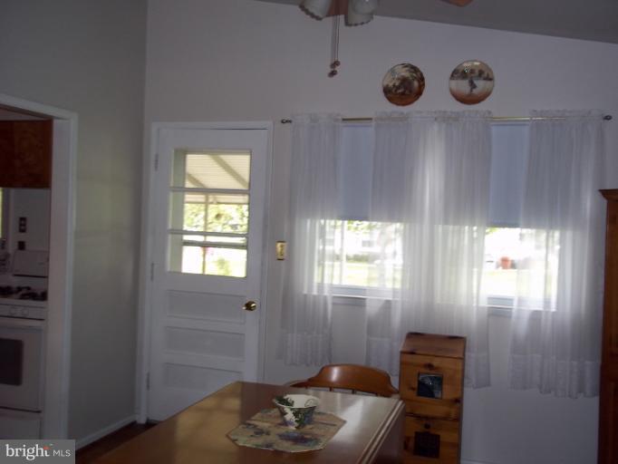6919 Digby Road Gwynn Oak, MD 21207 - Photo 3 of 24 a room with furniture and a window