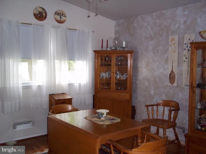 6919 Digby Road Gwynn Oak, MD 21207 - Photo 7 of 24 a dining room with furniture and window
