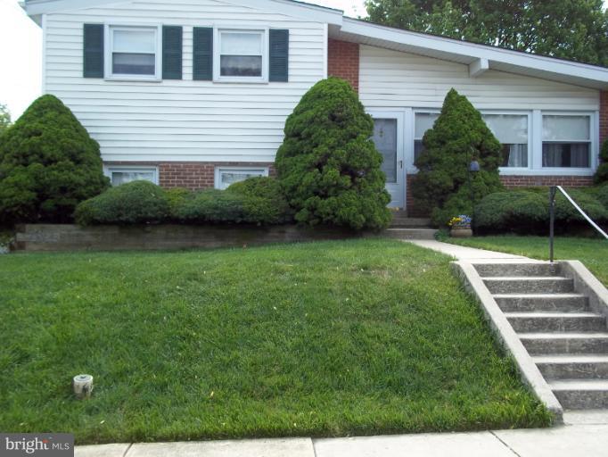 6919 Digby Road Gwynn Oak, MD 21207 - Photo 9 of 24 a house view with a garden space