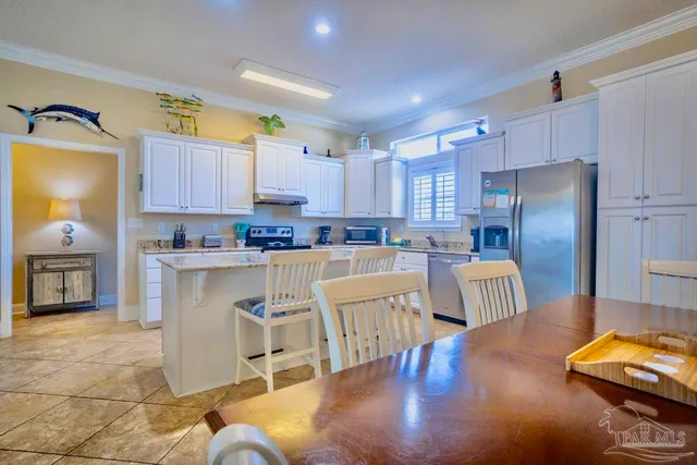 a stove top oven sitting inside of a kitchen