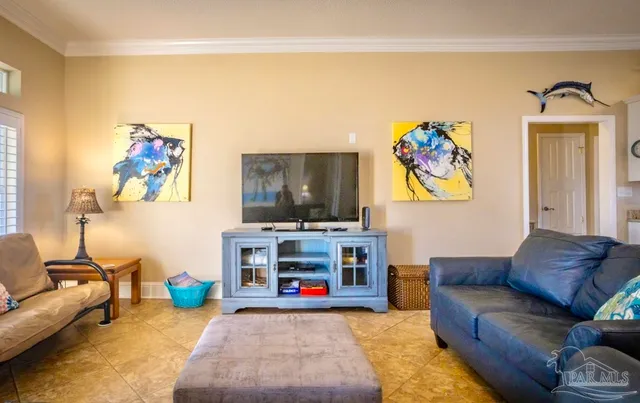 a living room with furniture and a flat screen tv