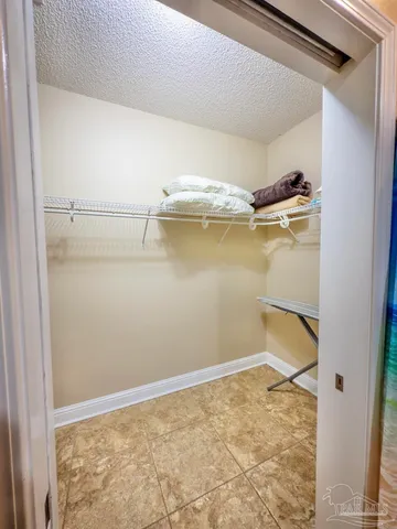 a bathroom with a sink a toilet and shower curtain