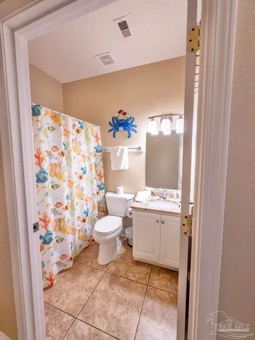 a view of a patio with table and chairs