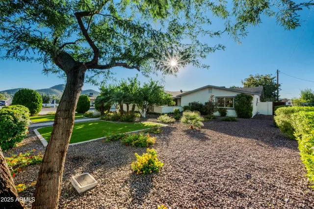 a bedroom with furniture and a large window