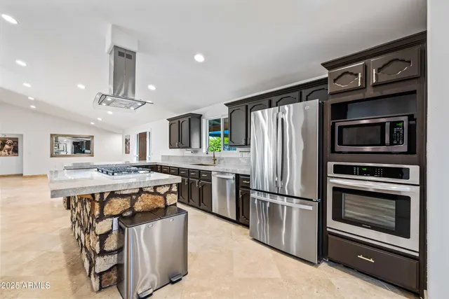 a kitchen with a table and chairs in it