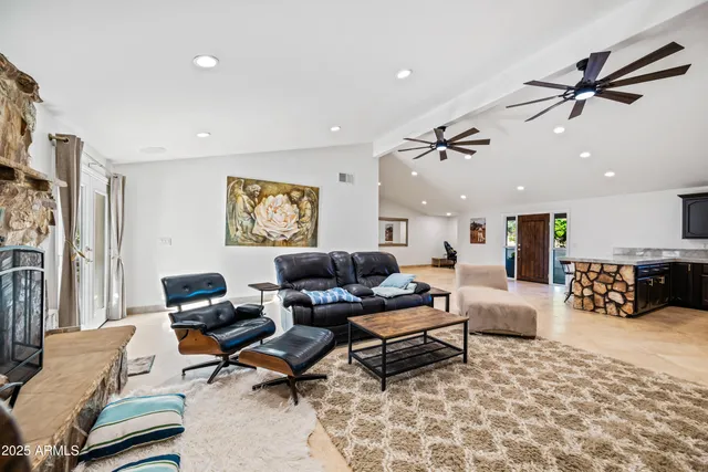 an aerial view of an chairs and umbrellas