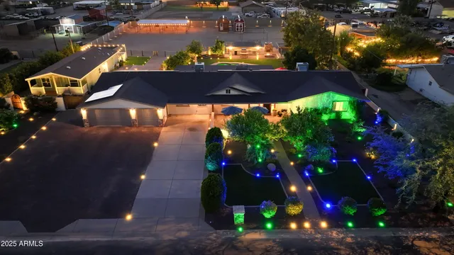 a view of a garden with a house in the background