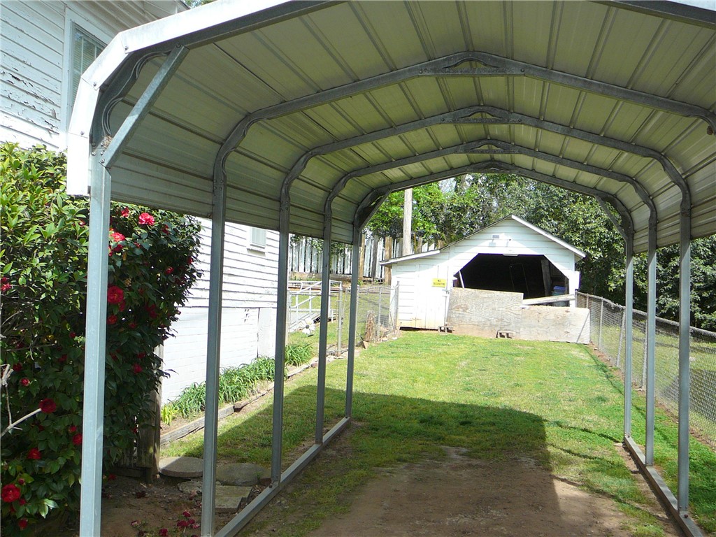 306 B Street Anderson, SC 29625 - Photo 3 of 8 This outdoor space offers covered parking and a useful shed with a fenced yard.