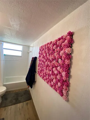 a bathroom with a bathtub and toilet