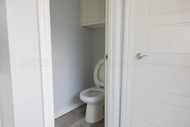 a bathroom with a toilet and a sink