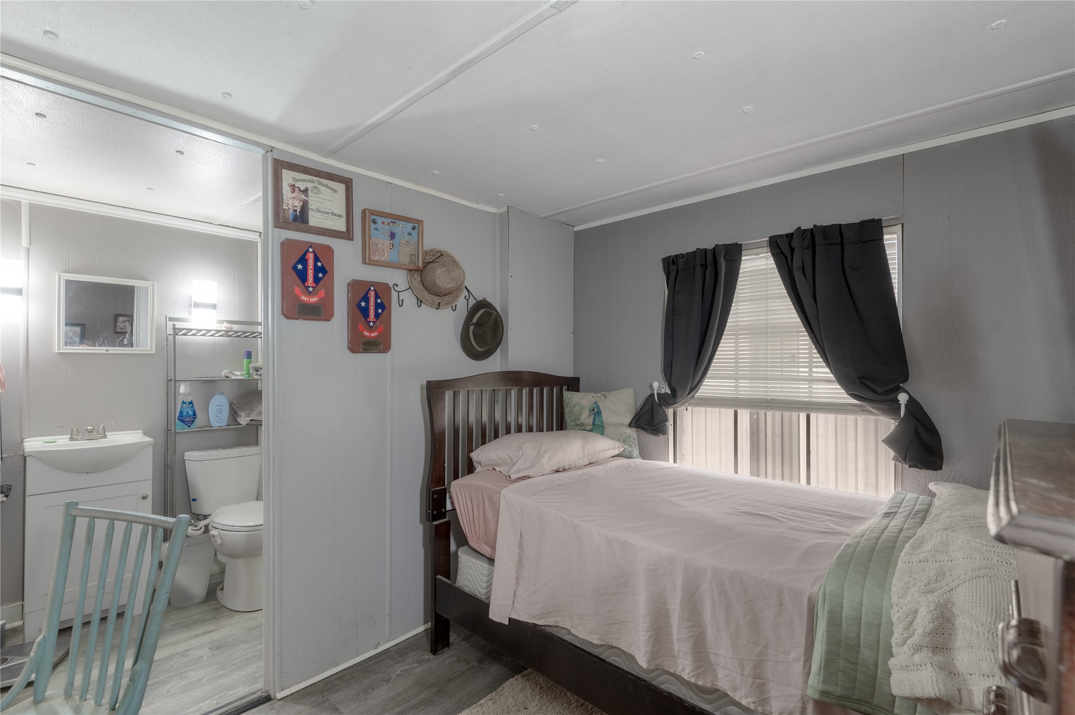 159 Pecan Avenue Groveton, TX 75845 - Photo 12 of 27 a bedroom with a bed and a window