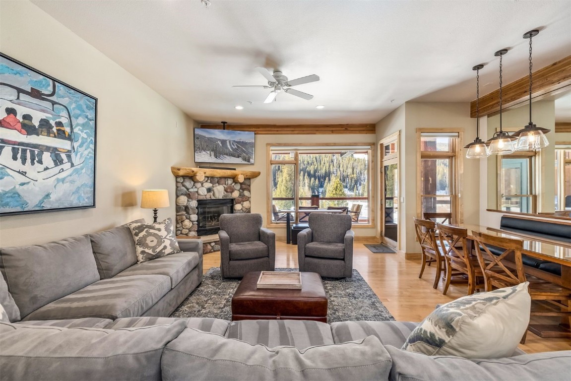 56 River Run Road, Unit 201 Keystone, CO 80435 - Photo 3 of 44 a living room with furniture fireplace and a large window