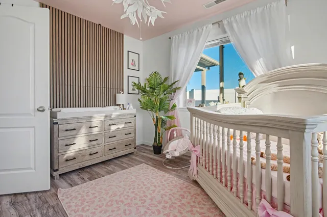 a bedroom with furniture and a window