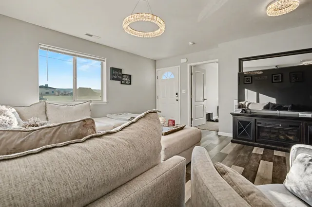 a living room with furniture and a window