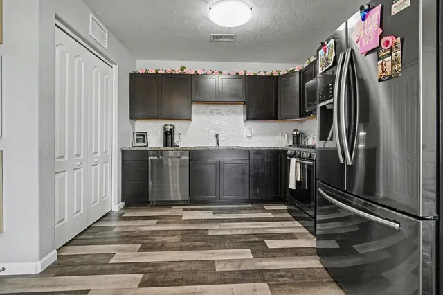 a bathroom with a sink a mirror and a shower