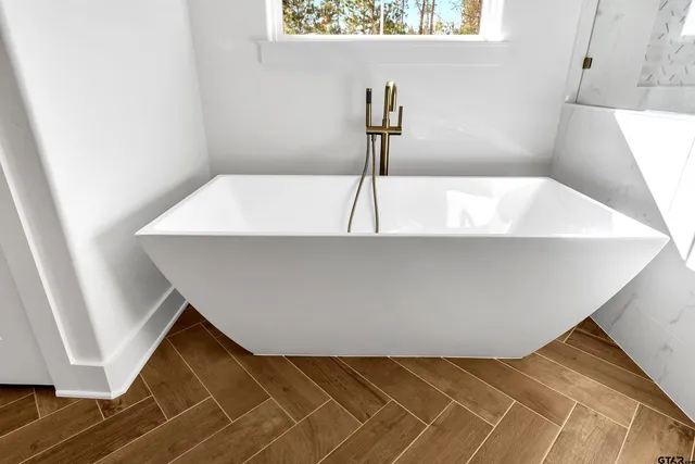 a view of a hall with an entryway