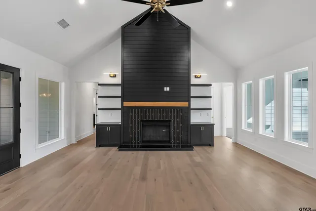 a bathroom with a sink mirror and toilet