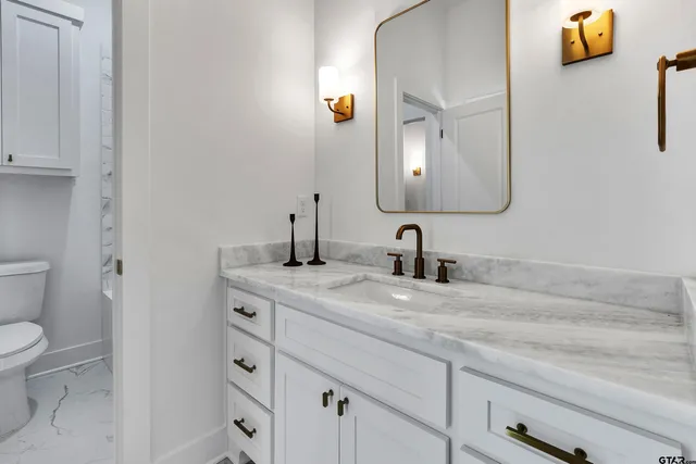 a view of kitchen cabinets and wooden floor