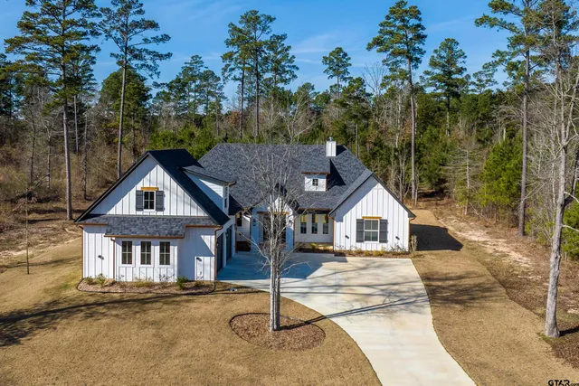 a view of a lake with a house and outdoor space
