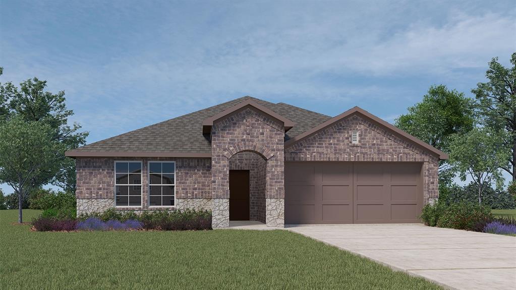 a front view of a house with a garden and yard