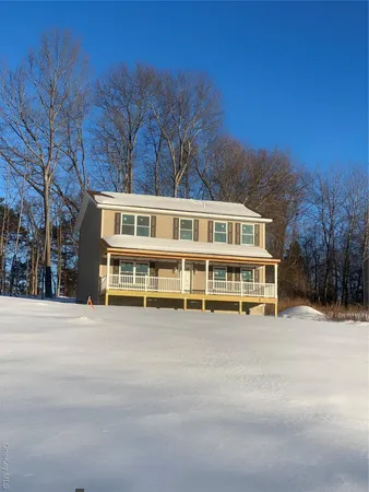 a view of a house with a large trees