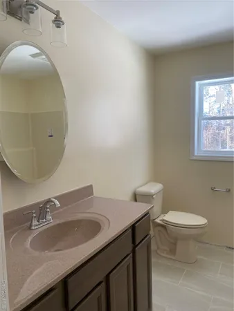 a bathroom with a sink a vanity and a mirror