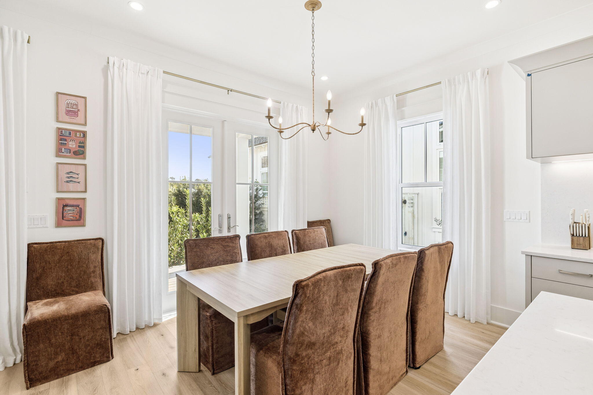 41 West Pollard Cove Inlet Beach Inlet Beach, FL 32461 - Photo 28 of 54 a view of a dining room with furniture and a chandelier