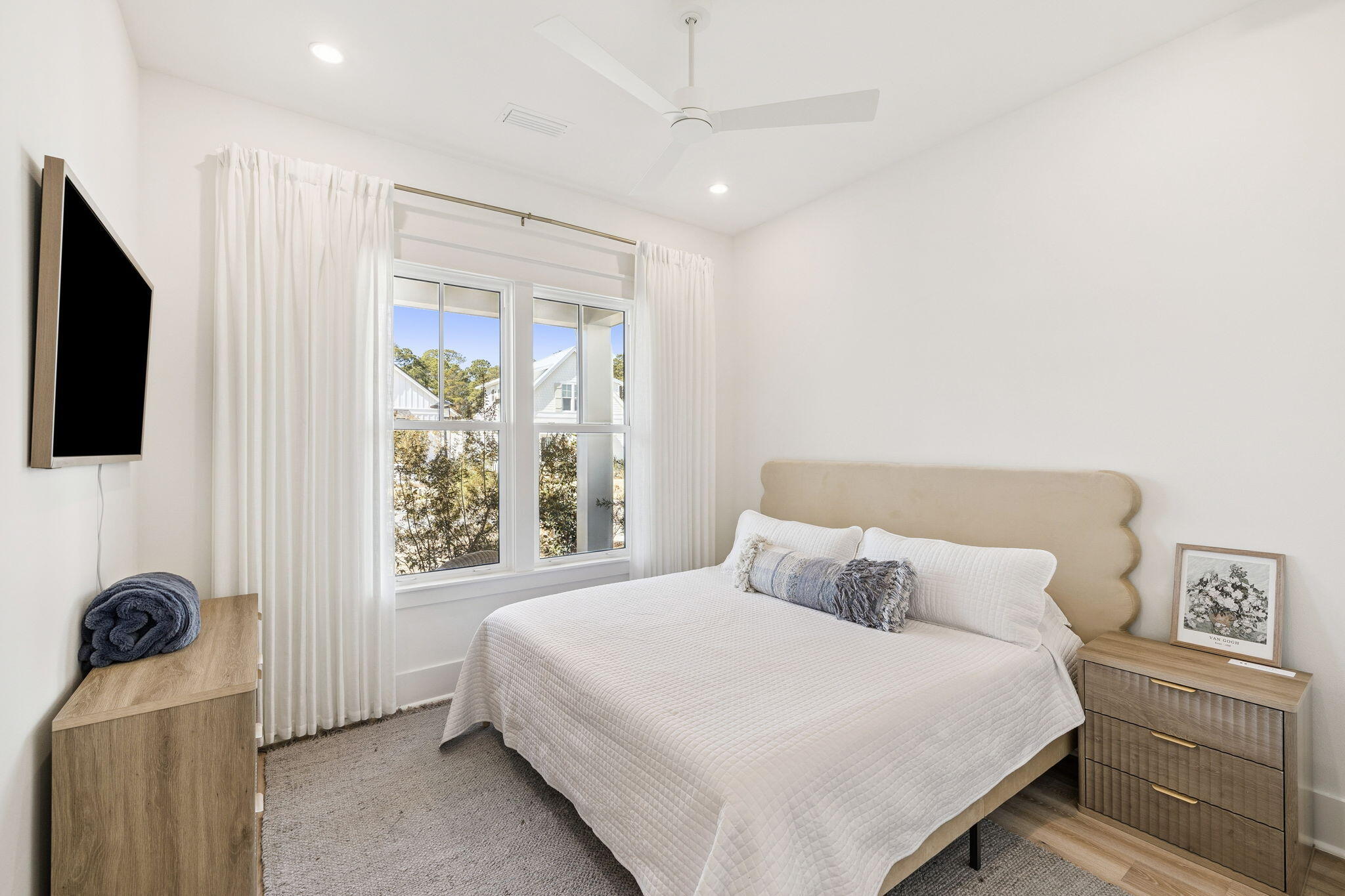 41 West Pollard Cove Inlet Beach Inlet Beach, FL 32461 - Photo 33 of 54 a bedroom with a bed and a flat tv screen on the dresser
