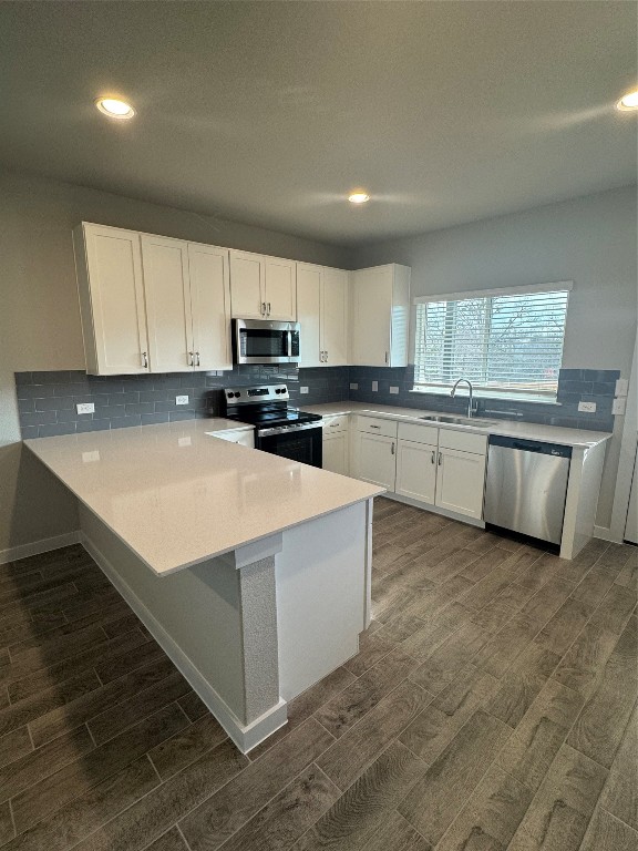 2604 Totley Road Manor, TX 78653 - Photo 1 of 1 a kitchen with stainless steel appliances granite countertop a stove top oven a sink and white cabinets