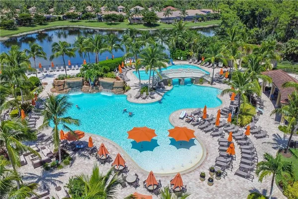 an aerial view of a house patio swimming pool and outdoor seating