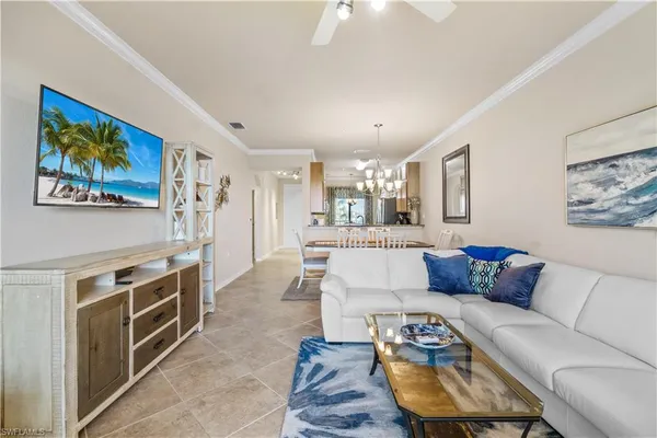 a living room with furniture and a rug