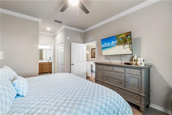 a bedroom with a bed and a dresser