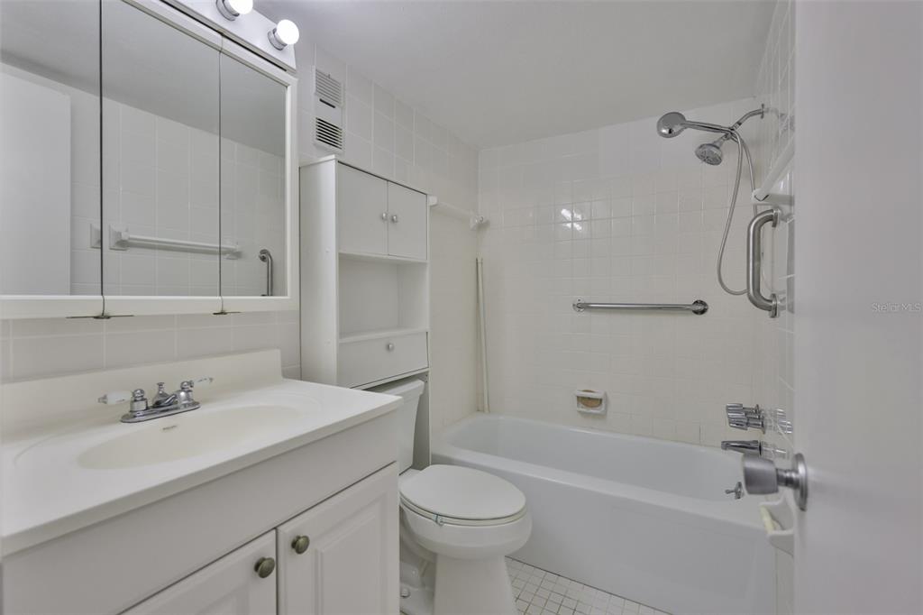 801 83rd Avenue North, Unit 118 St. Petersburg, FL 33702 - Photo 15 of 37 a bathroom with a sink toilet tub and shower