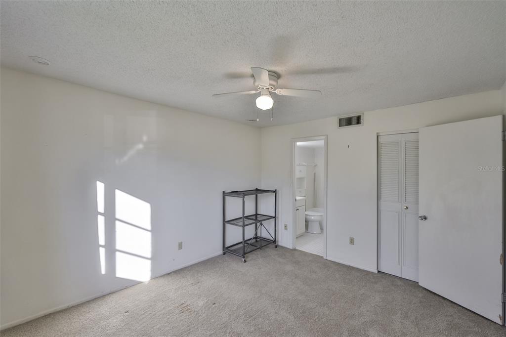 801 83rd Avenue North, Unit 118 St. Petersburg, FL 33702 - Photo 18 of 37 a view of an empty room with a window