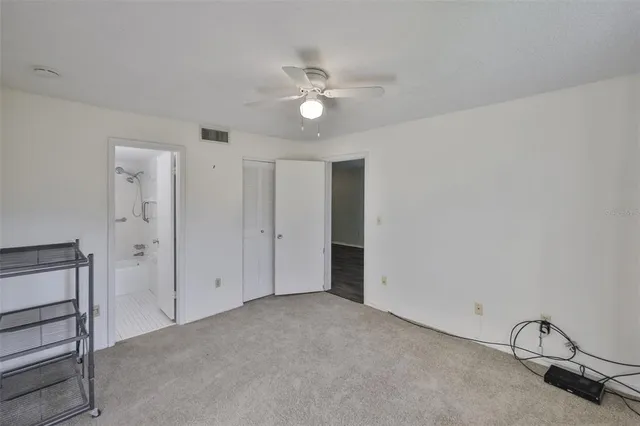 a view of a livingroom with a ceiling fan