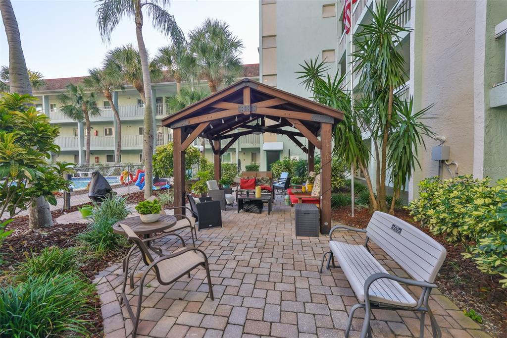 801 83rd Avenue North, Unit 118 St. Petersburg, FL 33702 - Photo 28 of 37 a view of a chairs and table in the patio