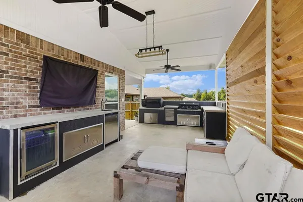 a kitchen with stainless steel appliances granite countertop a stove and a microwave